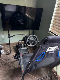 Complete Logitech racing sim. Console or pc compatible. Logitech wheel