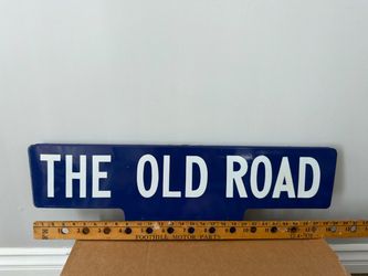 The old road blue porcelain sign