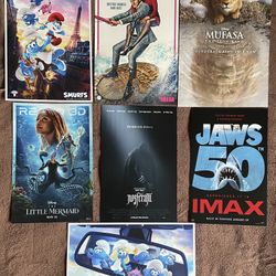 7 Movie Posters: Mufasa The Lion King, Jaws, Nosferatu, The Naked Gun, The Little Mermaid. Smurfs