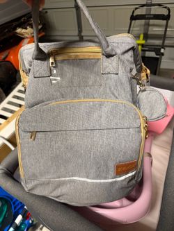 Diaper bag with changing station