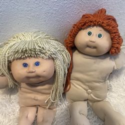 Two original cabbage patch dolls, no clothes, need someone to take these. 