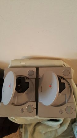 2 Sony Playstation's with 2 Controllers, All cable, + 14 Games