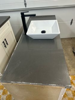 Vanity with vessel sink and black matte Faucet