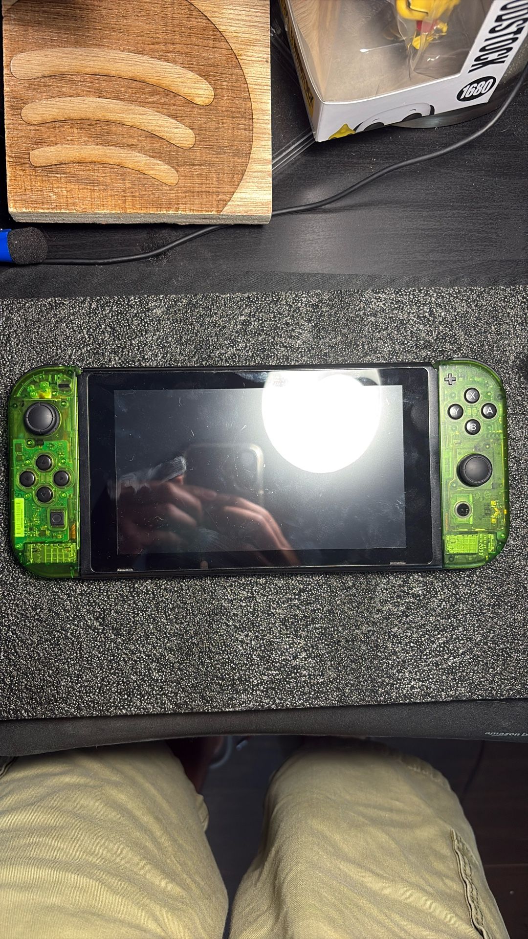 Nintendo Switch Used With A Green Transparent Mod