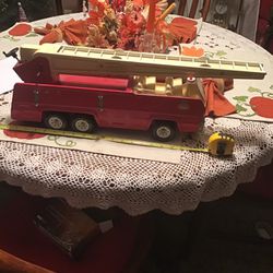 A metal Tonka fire truck it’s 9 inches tall and 19 inches long 