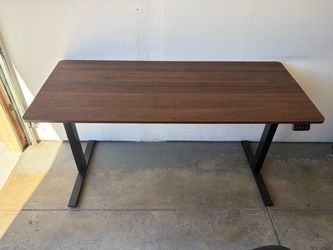 Brown wood veneer powered standing desk