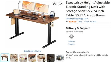 Height adjustable electric standing desk with storage shelf.