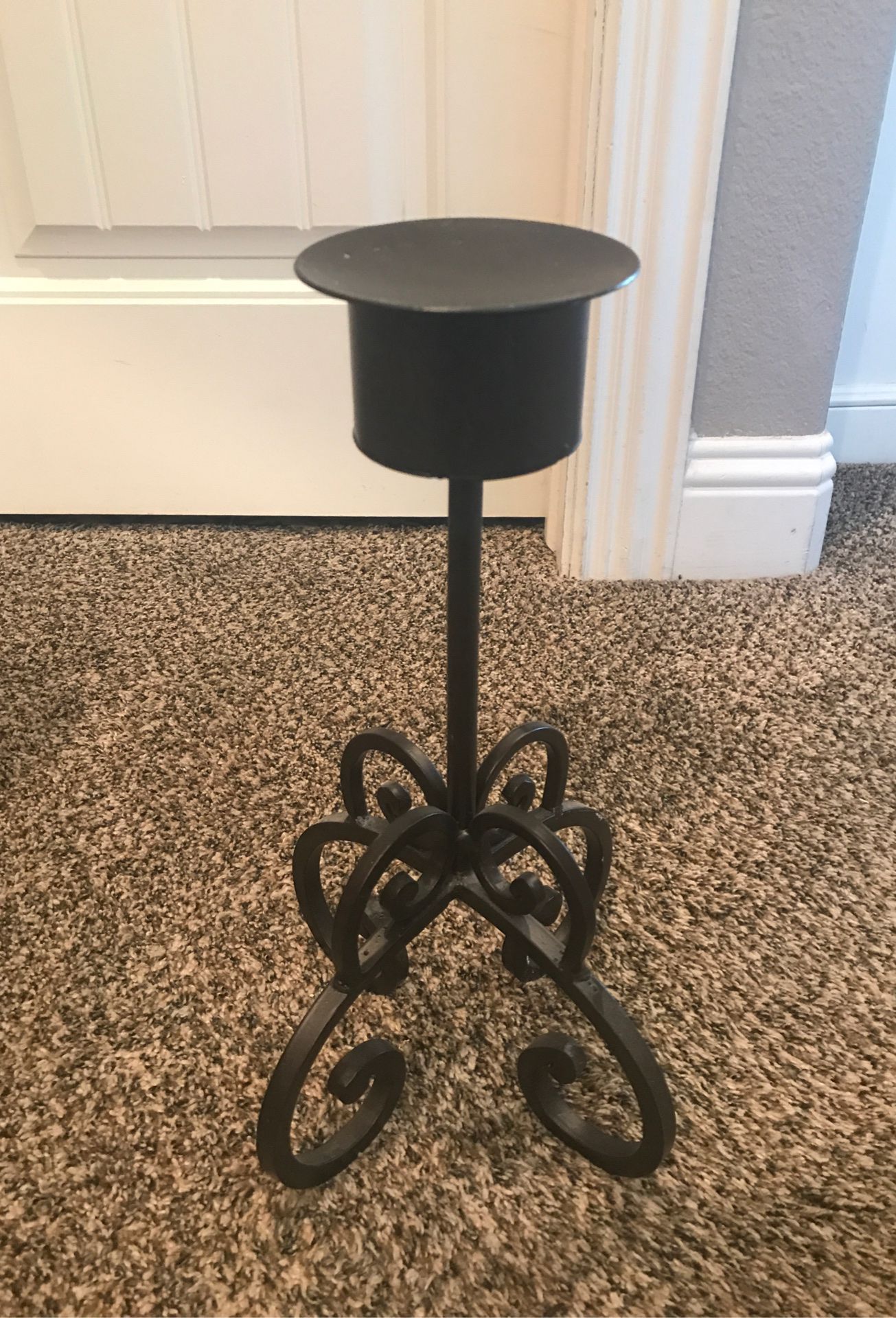 Solid metal candle holder