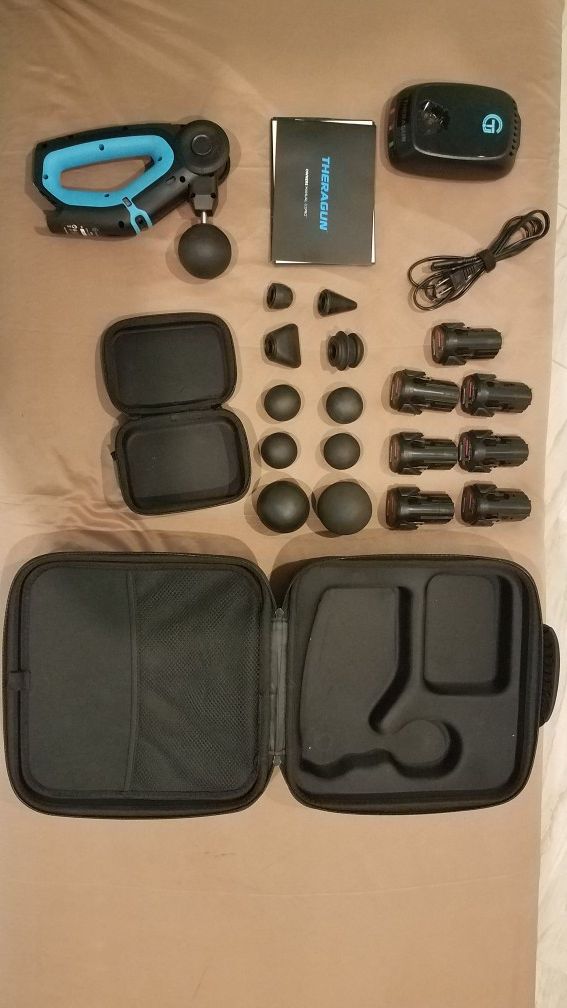 THERAGUN G2 PRO, lightly used with 5 batteries, 11 attachments