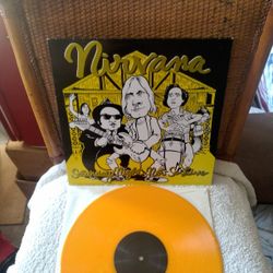Nirvana - Saturday Night Not So Live. On Orange Colored Vinyl. Cover has some little creases, Vinyl is in Excellent Condition.