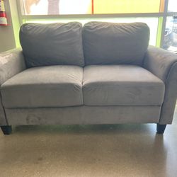 Nice used Gray loveseat in good condition free delivery