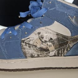 Nike Air Jordan 1 Retro Alpha in the "White University Blue" colorway, released in 2007 to tribute Michael Jordan's college days at UNC.