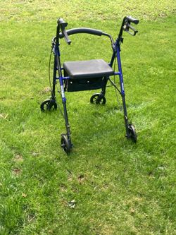Walker with seat and brakes