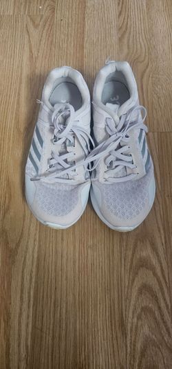Adidas sneakers with silver stripes