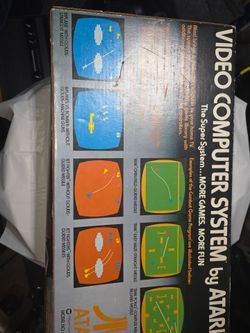 Atari with box and 4 games Pac-Man game in box