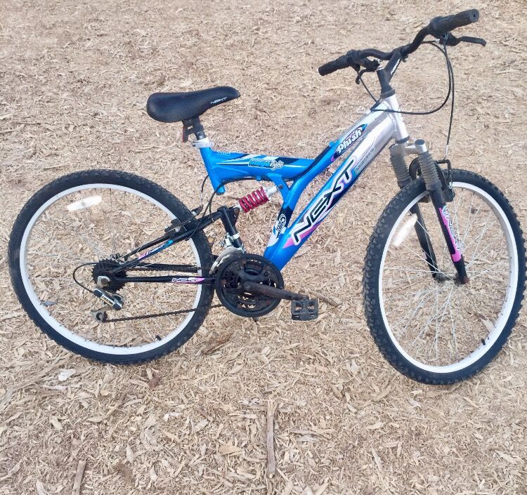 Next 26” 21 speed aluminum alloy mega light plush blue, silver, pink, black & white full suspension mountain bike
