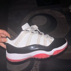 Red and white Jordan 11 retro trainers 