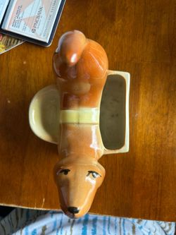Wiener dog that holds rings wha and bracelets