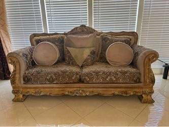 “Elegant 3 -piece living room sofa set for sale. Includes one sofa, one loveseat, and two matching chairs. Traditional carved wood design with matchin