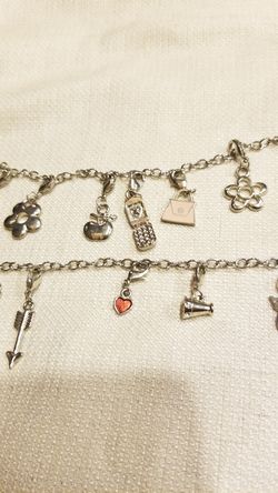 2 silver toned charm bracelets (Sunset & Fort Apache)