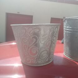 Nice metal bucket for plants or can be used to ice down drinks ect..9 inches tall x 10 1/2 inches   x 10 1/2 inches on top