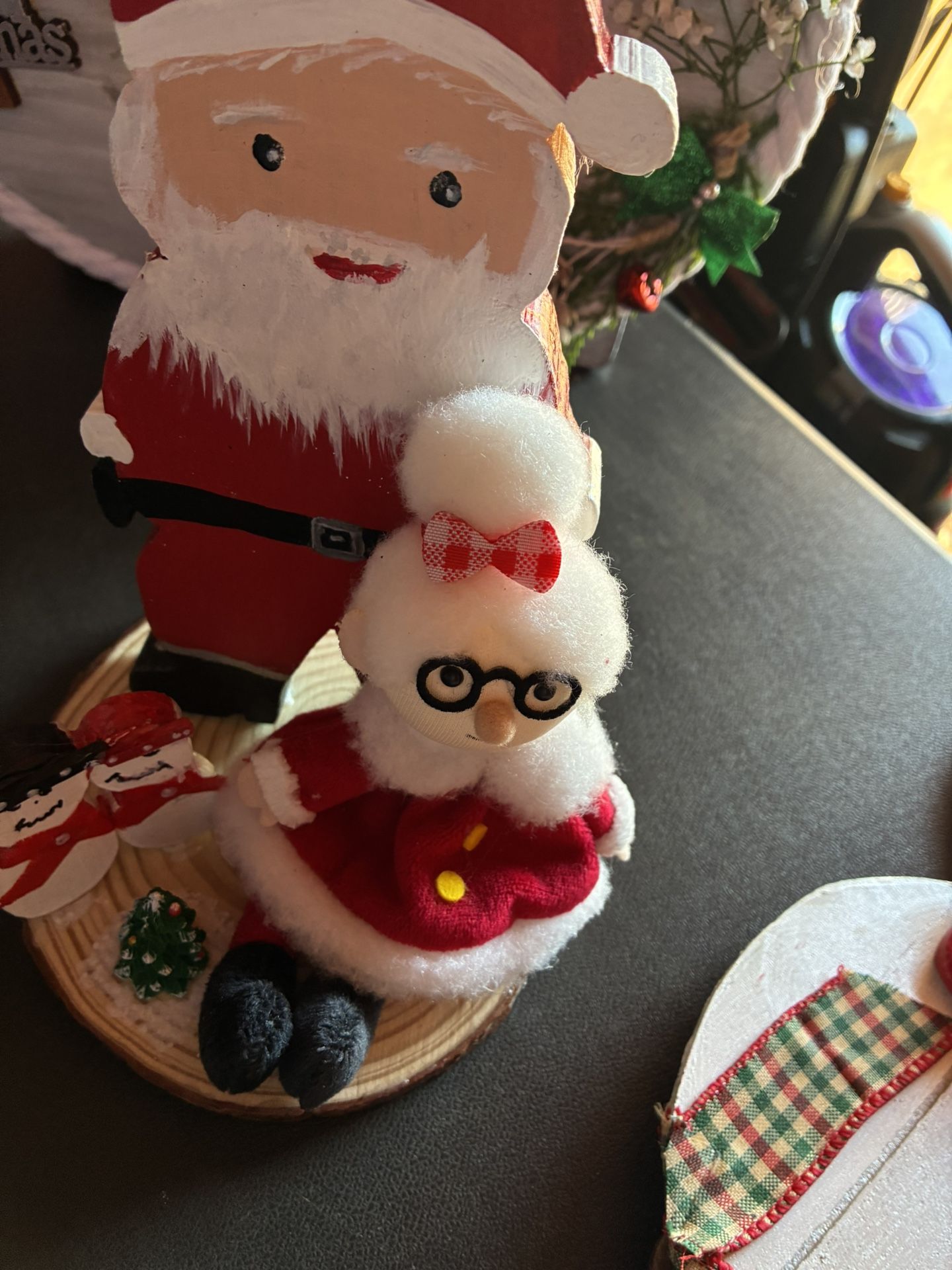 Mr. And Mrs. Claus Sitting With Mr. And Mrs. Snowman