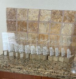 Acrylic Rectangular Table Numbers for tables 1-12. Teches white letter If and rose design. Wood base painted hold. Used once for wedding. Perfect cond