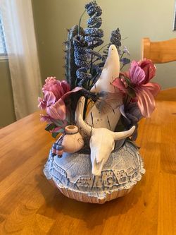 Southwest adobe house pottery vase with clay coyote & skull mixed with faux cactus & flowers. 11x6”