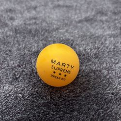 MARTY SUPREME TIMOTHEE CHALAMET 2025 A24 OFFICIAL PROMO ORANGE PING PONG BALL movie