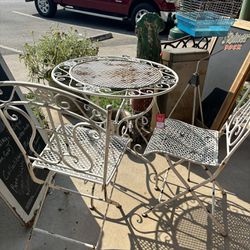 Metal table and chairs.  Chairs fold up for storage. This is a vintage set. Table measures 28x29.5 inches.  Chairs measure 15.5x20x36 inches.  95.00 f