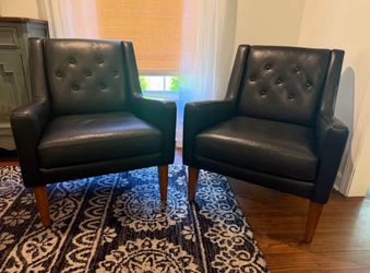 Pair of Mid-Century Modern Black Leather Tufted Armchairs