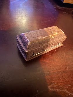 Tiny coffin figurine display