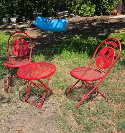 Vintage bistro Coca-Cola Metal Folding Chairs and a folding table.