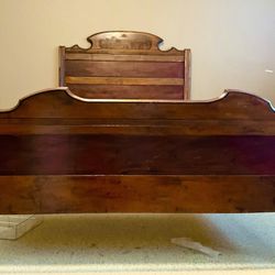 Victorian or Eastlake period about 1870’s 1880’s , this full or double size bed was hand carved of solid walnut with matched burl panels