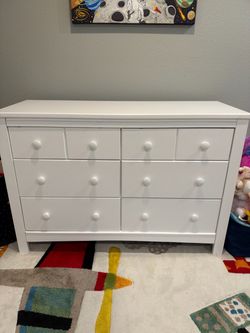 White wooden nursery double dresser