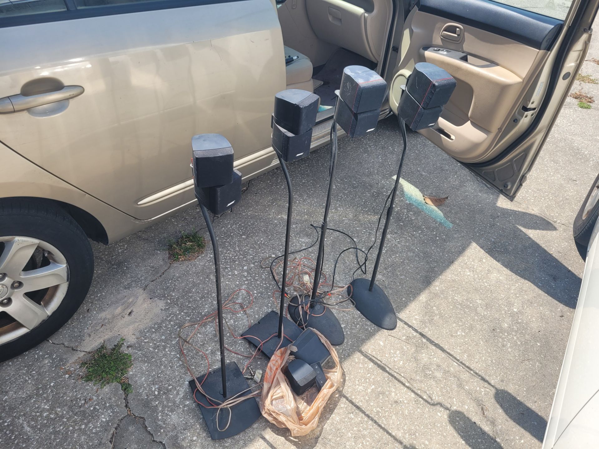 4 Bose Surround Sound Speakers with stands and extra speakers, remote. Everything for $50 FIRM