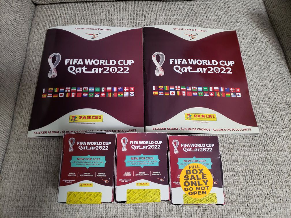 Panini World Cup Qatar 2022 Brand New And Sealed Box Of Stickers My Last 2 Red Boxes Available And 2 Albums (50 Packs In Each Box) Messi, Ronaldo?