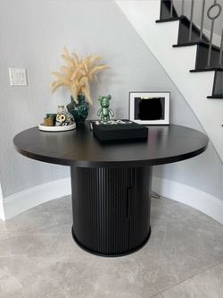 Black round table (dining or accent table)