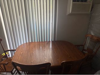 Wooden Dining room Table with 4 matching Chairs