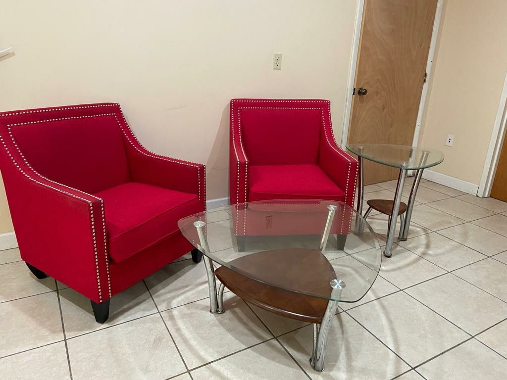 Red couches with tables