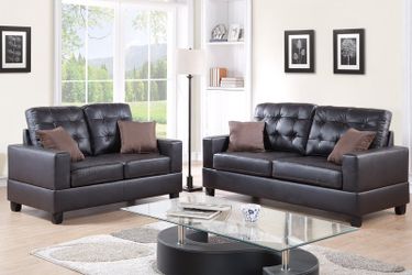 New black bonded leather sofa & loveseat with pillows