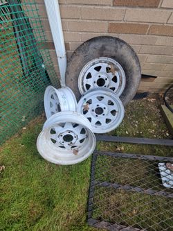 Trailer tire and 4 rims.
