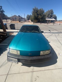 Car Chevrolet Sedan Teal Early 90s
