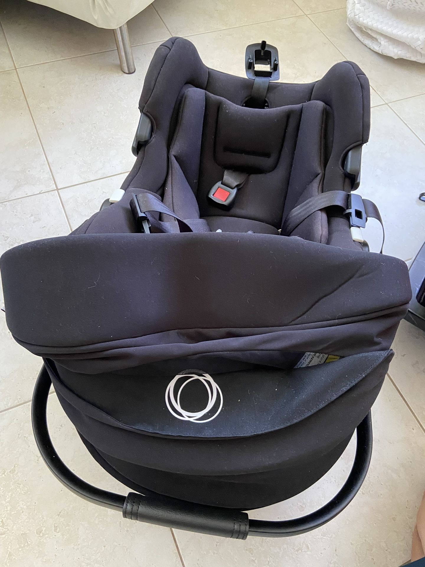 The Bugaboo Turtle One by Nina car seat with base