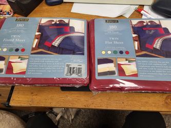Brand new twin flat and fitted sheets