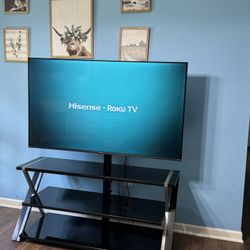 Hisense 58” 4K UHD Roku Smart TV  With Glass Entertainment Center