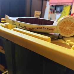 This is a Leinenkugel's Grapefruit Shandy beer tap handle, a collectible item for home bars or beer enthusiasts. 