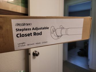 Adjustable closet rod with anchors