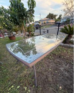 Cast aluminum glass top table $30