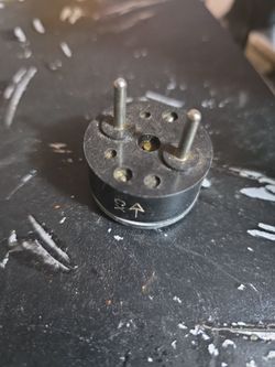 Small Round Metal Component with Pins